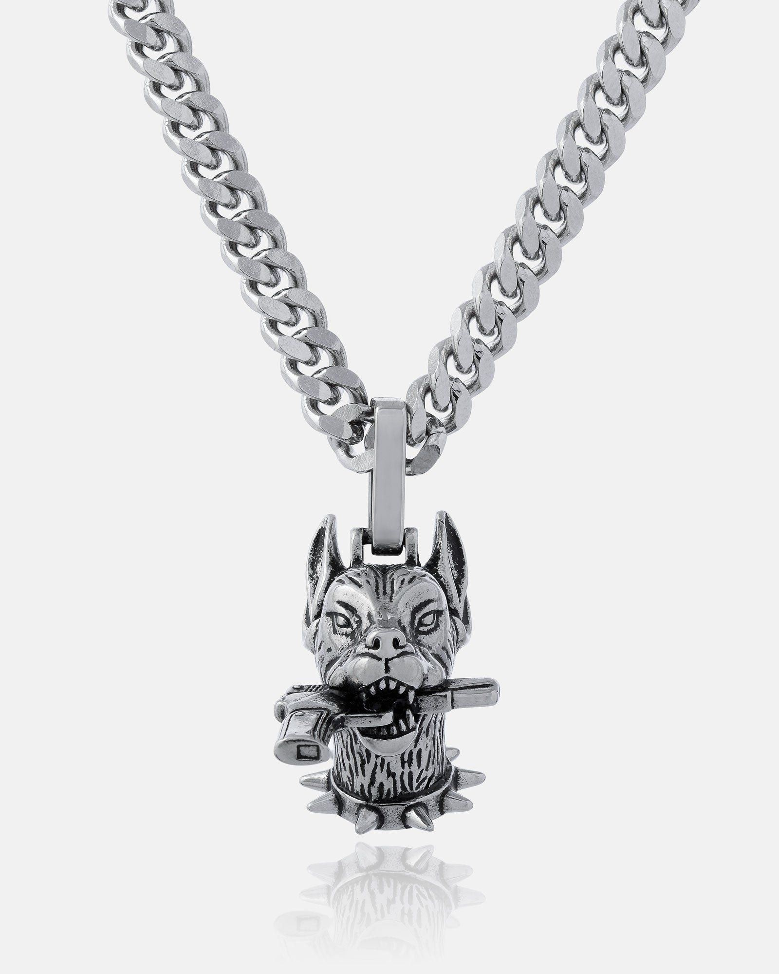 The Guard Dog" Pendant: A silver street necklace with a fierce Doberman head pendant, pointed ears, spiked collar, and metal bar—perfect for bold hip hop jewelry style.