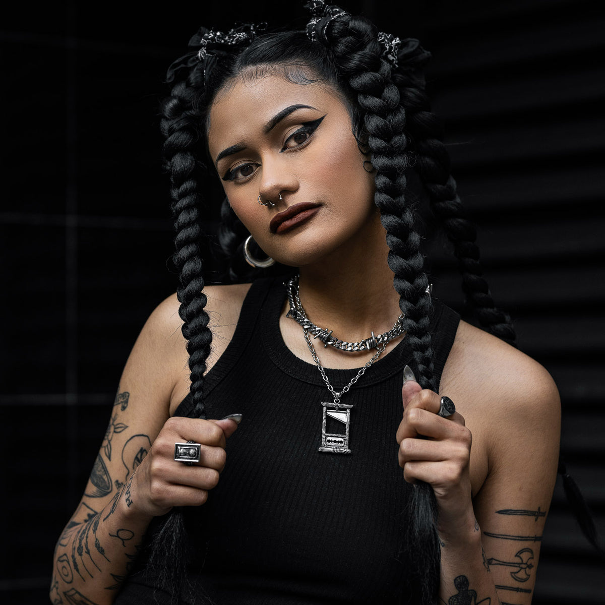 model wearing gothic necklace chains by statement collective