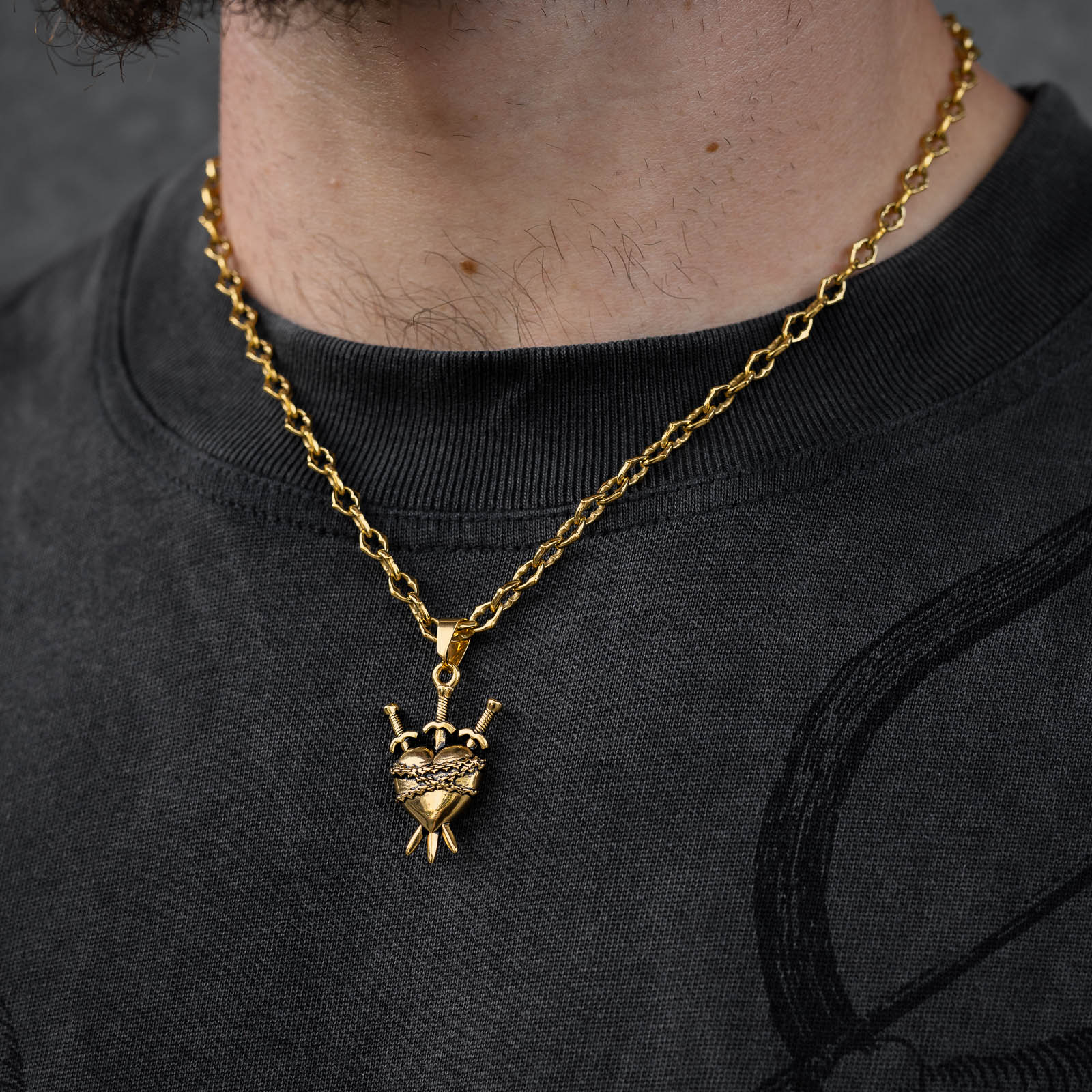spiked chain with heart pendant gold