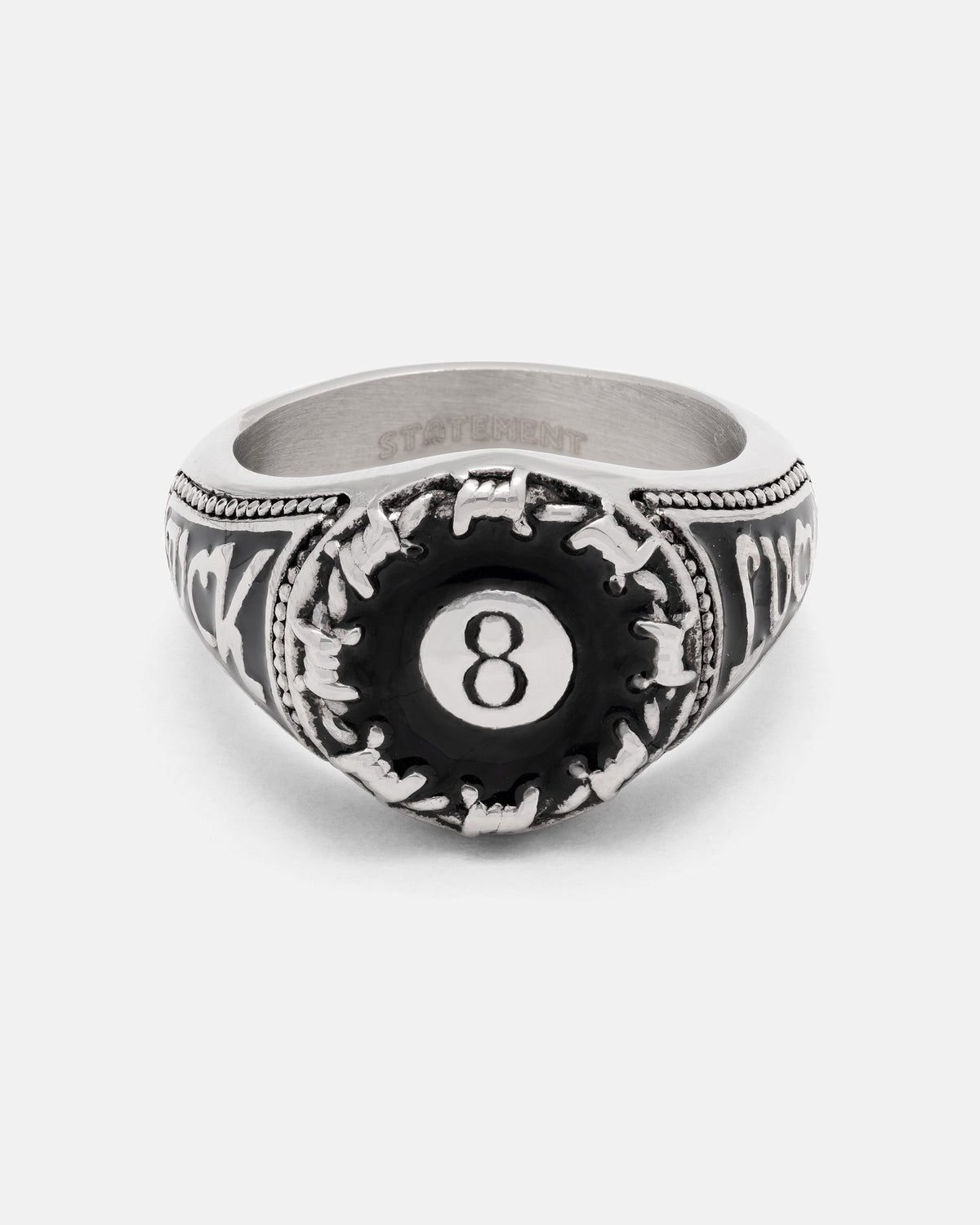 Lucky Shot Ring made of stainless steel, featuring an 8-ball emblem surrounded by barbed wire with script lettering on the sides.