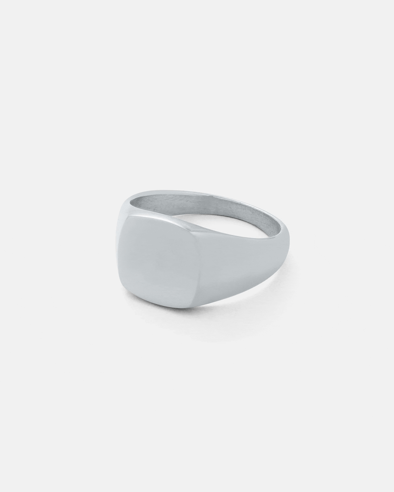 The Statement Collective Minimal Signet Ring features a smooth, flat square face and polished band in minimalist silver, shown on a plain white background.
