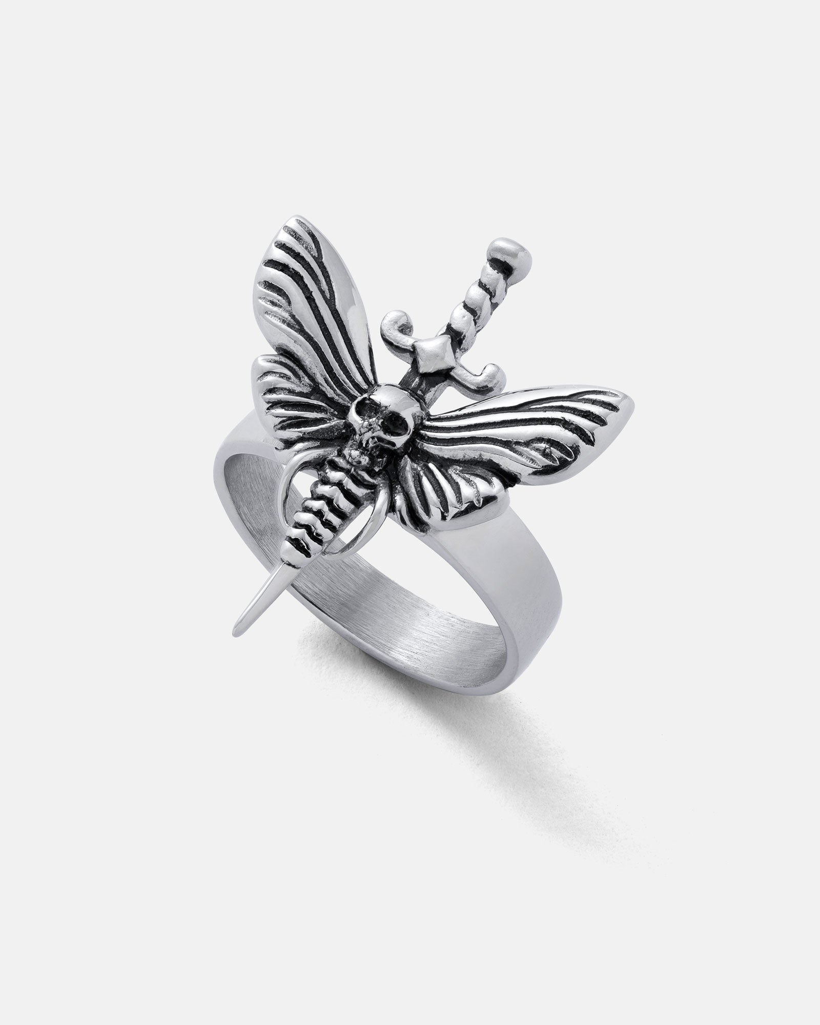The Death's Head Moth Ring features a silver butterfly design with a skull at its center and a vertical sword, set against a plain white background.