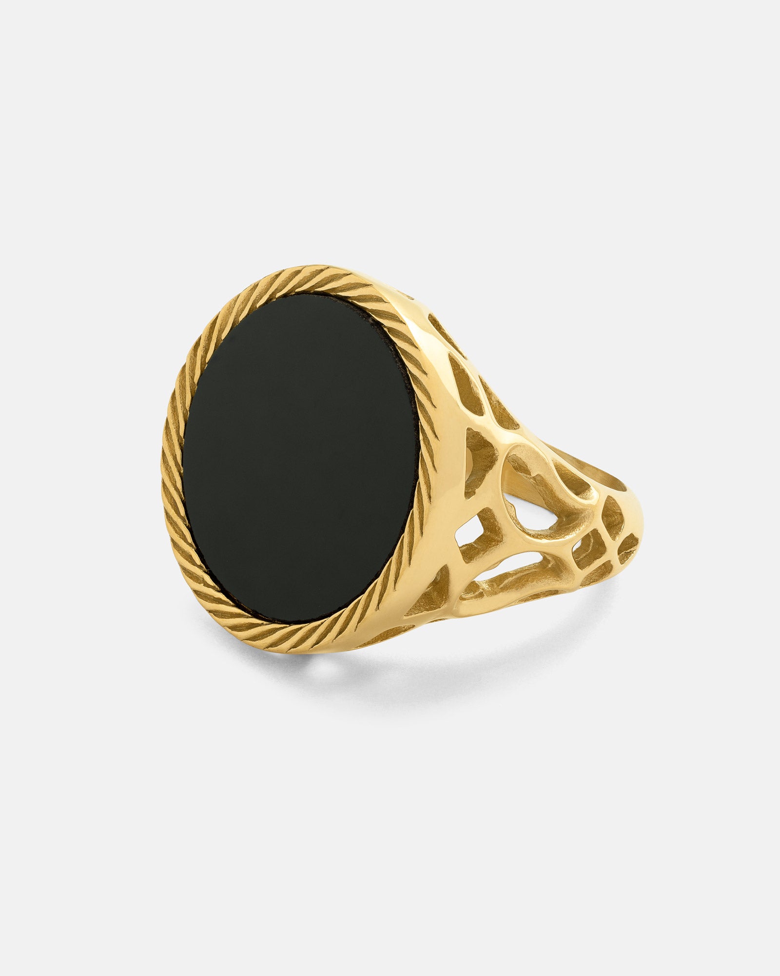 The Onyx Sovereign Ring (Gold) features an intricate cut-out band and a large, smooth round black stone—an ideal men’s statement jewelry piece.