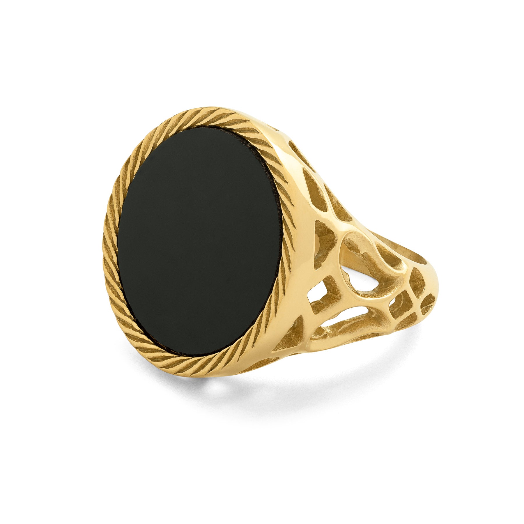 Gold ring with a black stone and intricate cutout patterns on the side on a white background