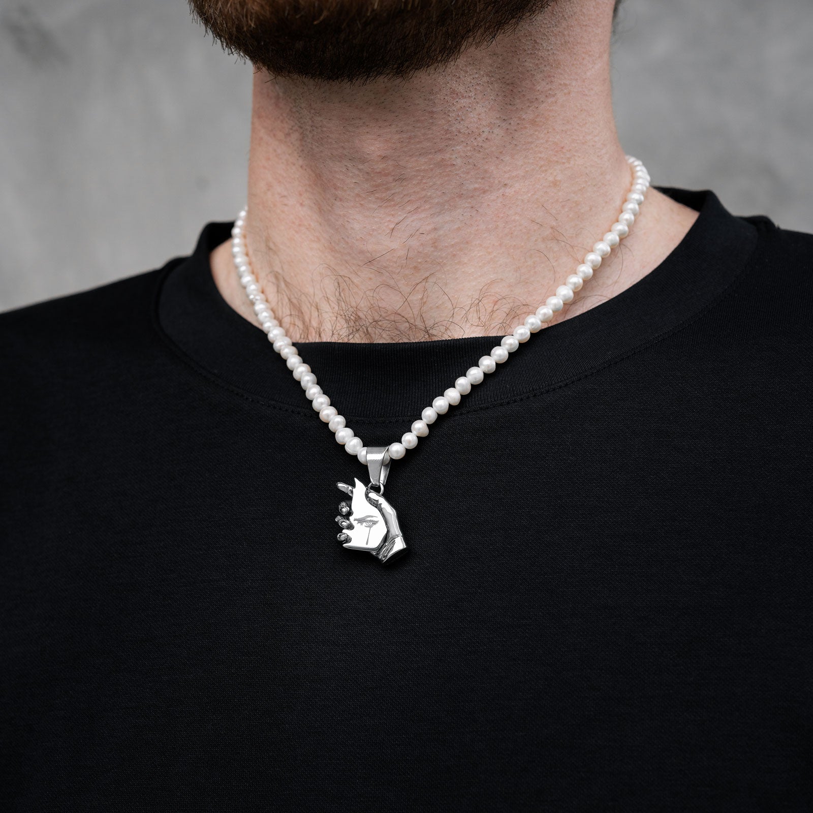 pearl necklace with silver hand pendant