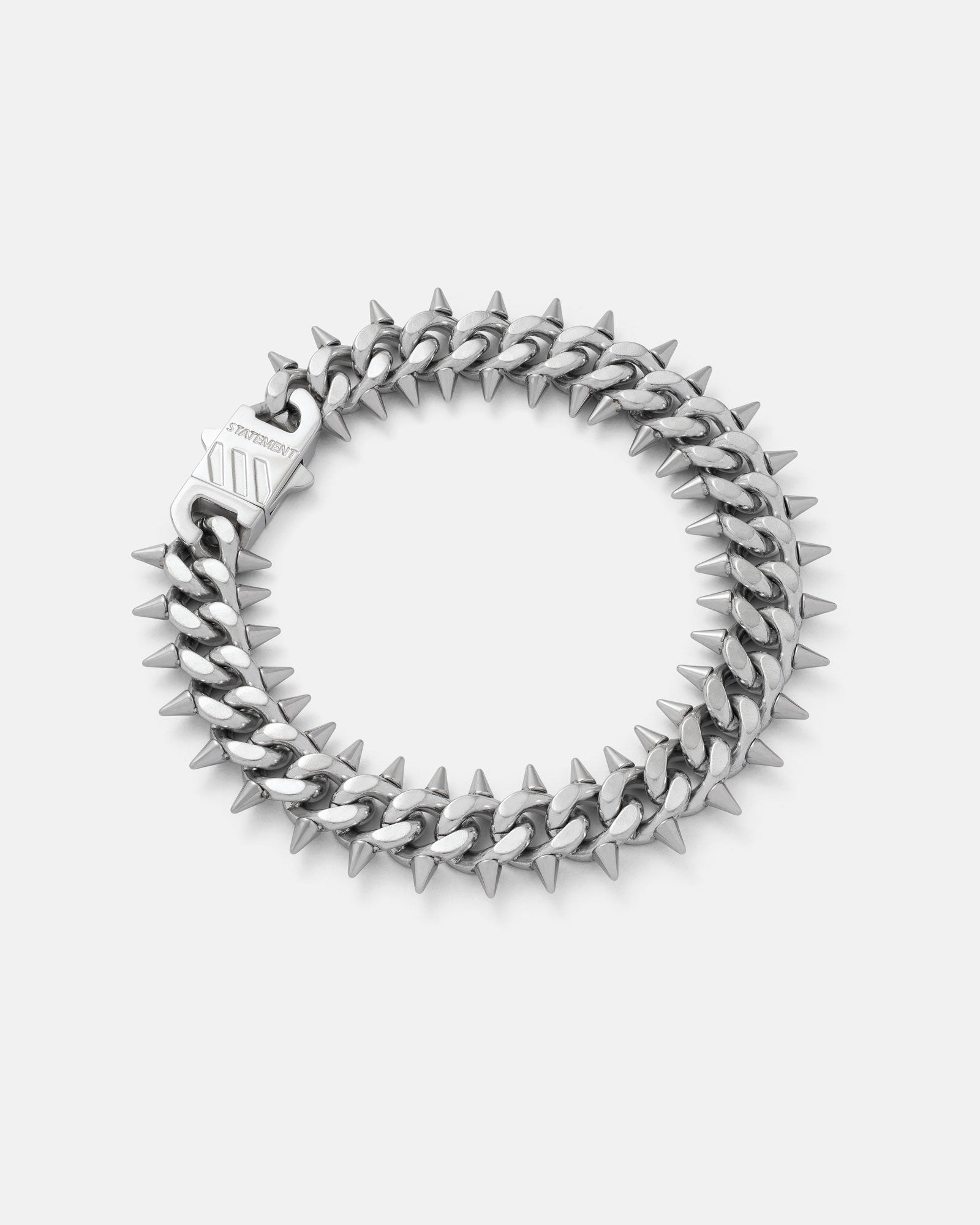 Silver 9mm spiked bracelet with screwed in spikes by statement collective on grey background 