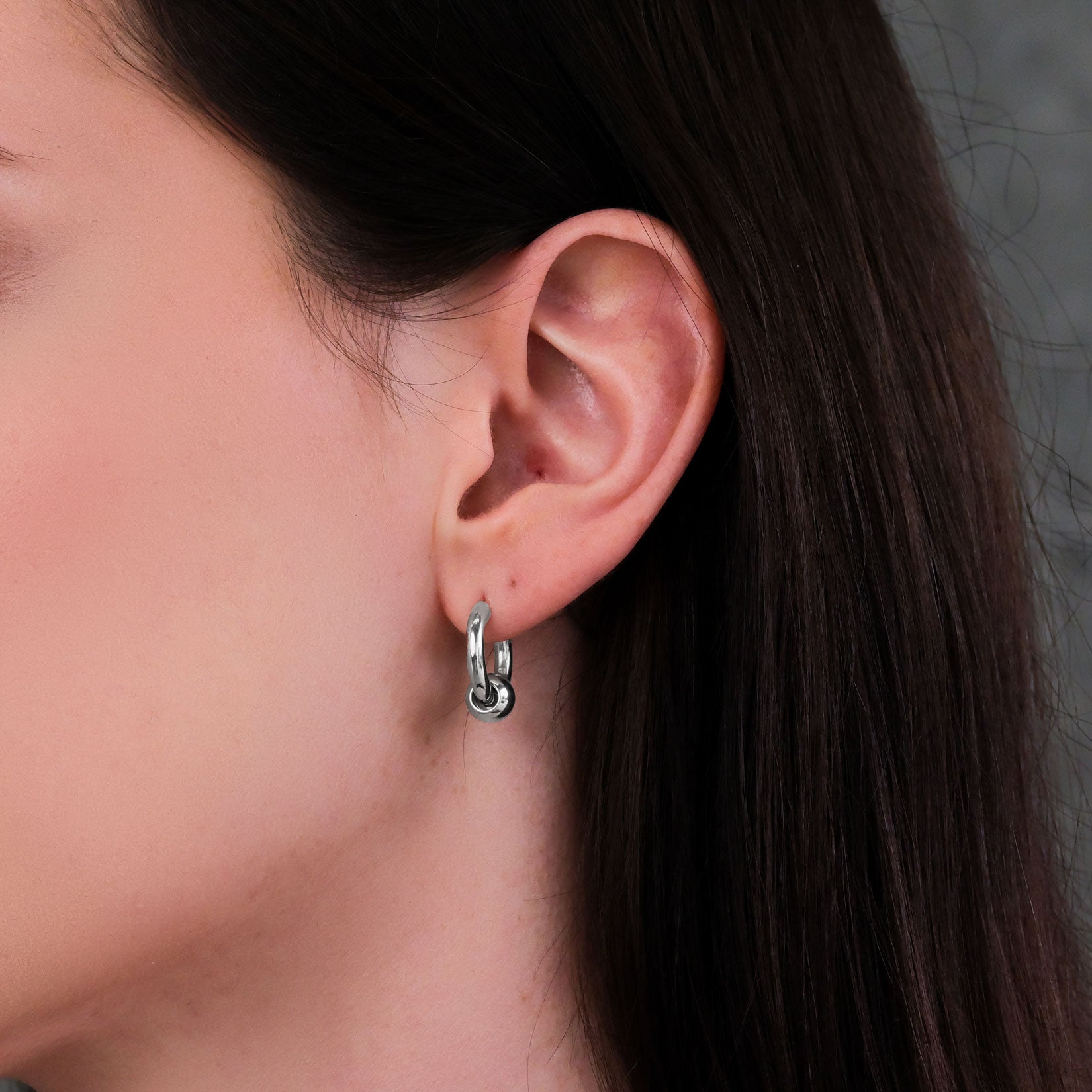 Women's punk earrings on body