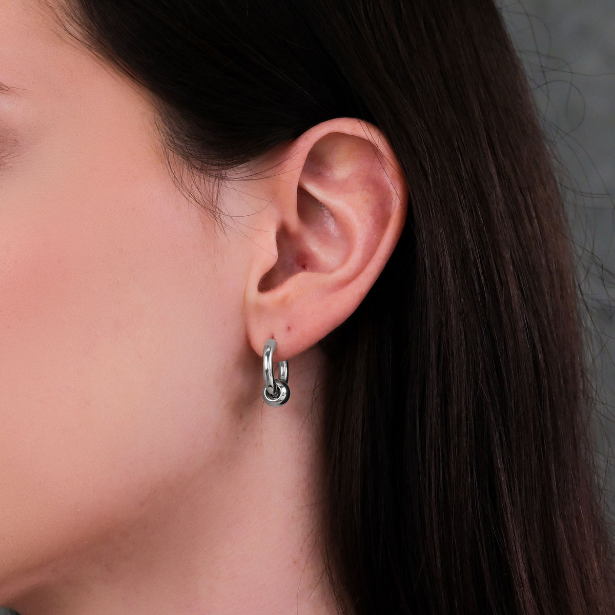 Women&#39;s punk earrings on body