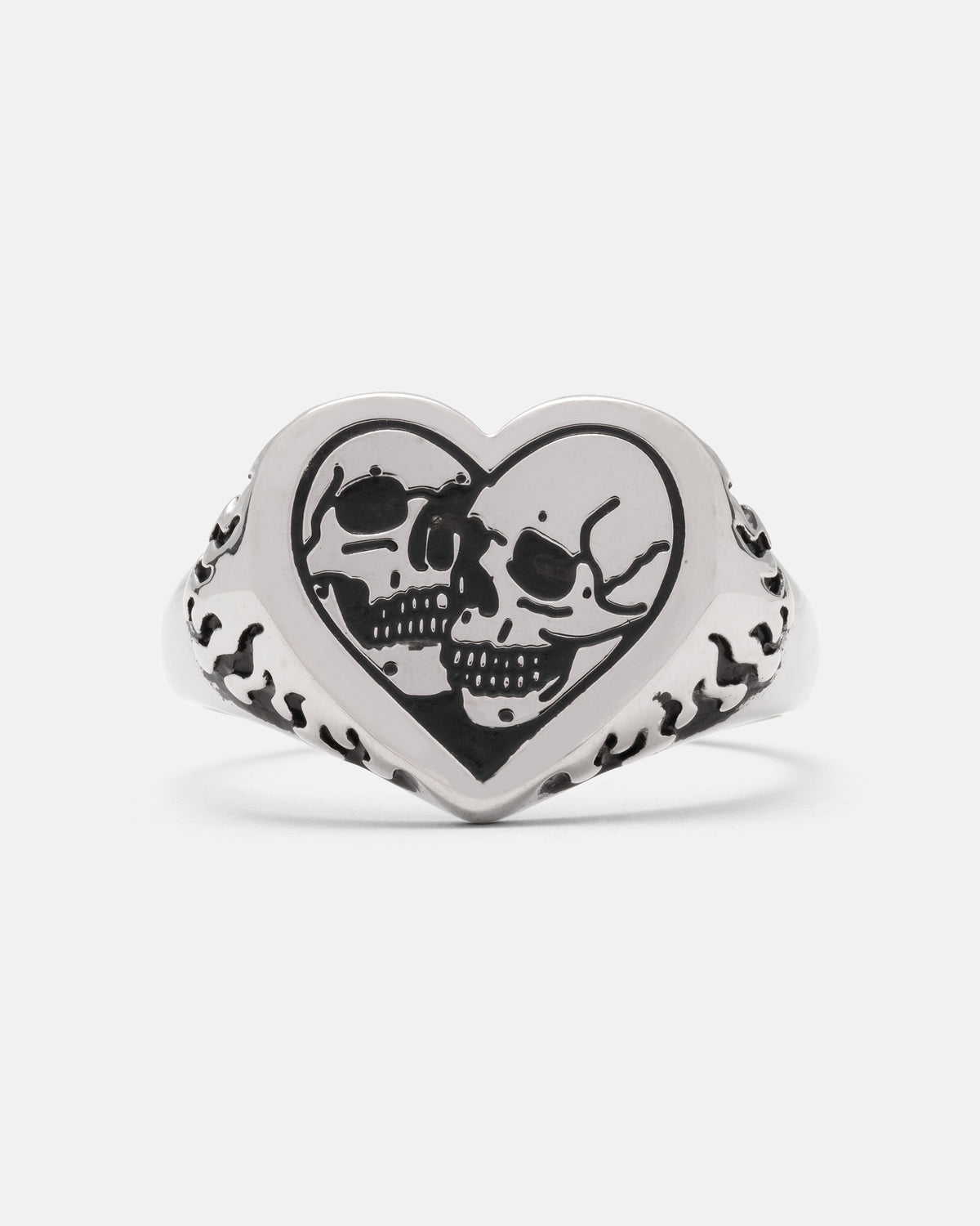 Silver Skull Heart Ring featuring two engraved skulls and flame detailing on the sides of this gothic jewelry piece.
