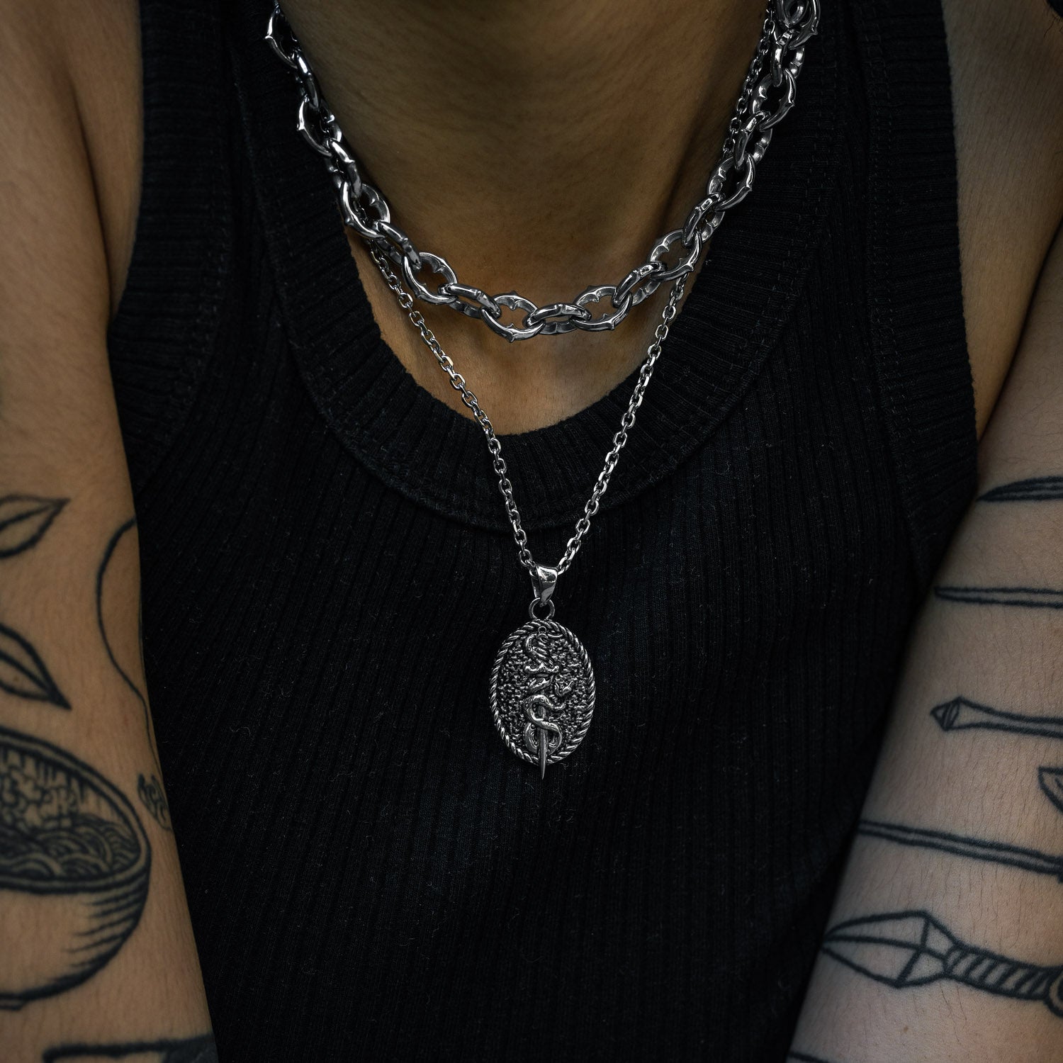 dagger with snake wrapped pendant necklace by statement collective