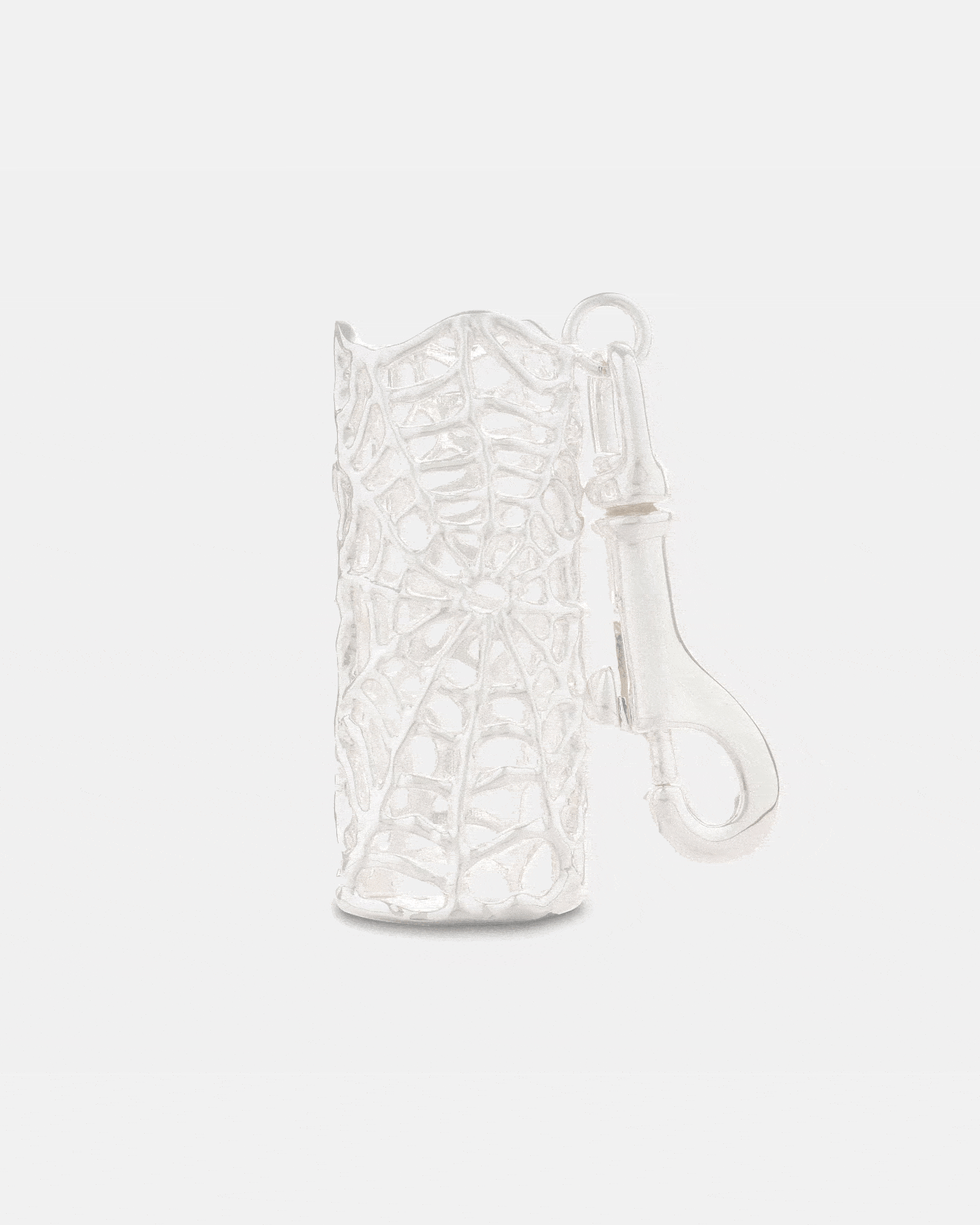 A silver Spiderweb Lighter Sleeve by Statement Collective, shaped like a cylindrical leaf skeleton with intricate vein patterns and an attached clasp for securing keys.