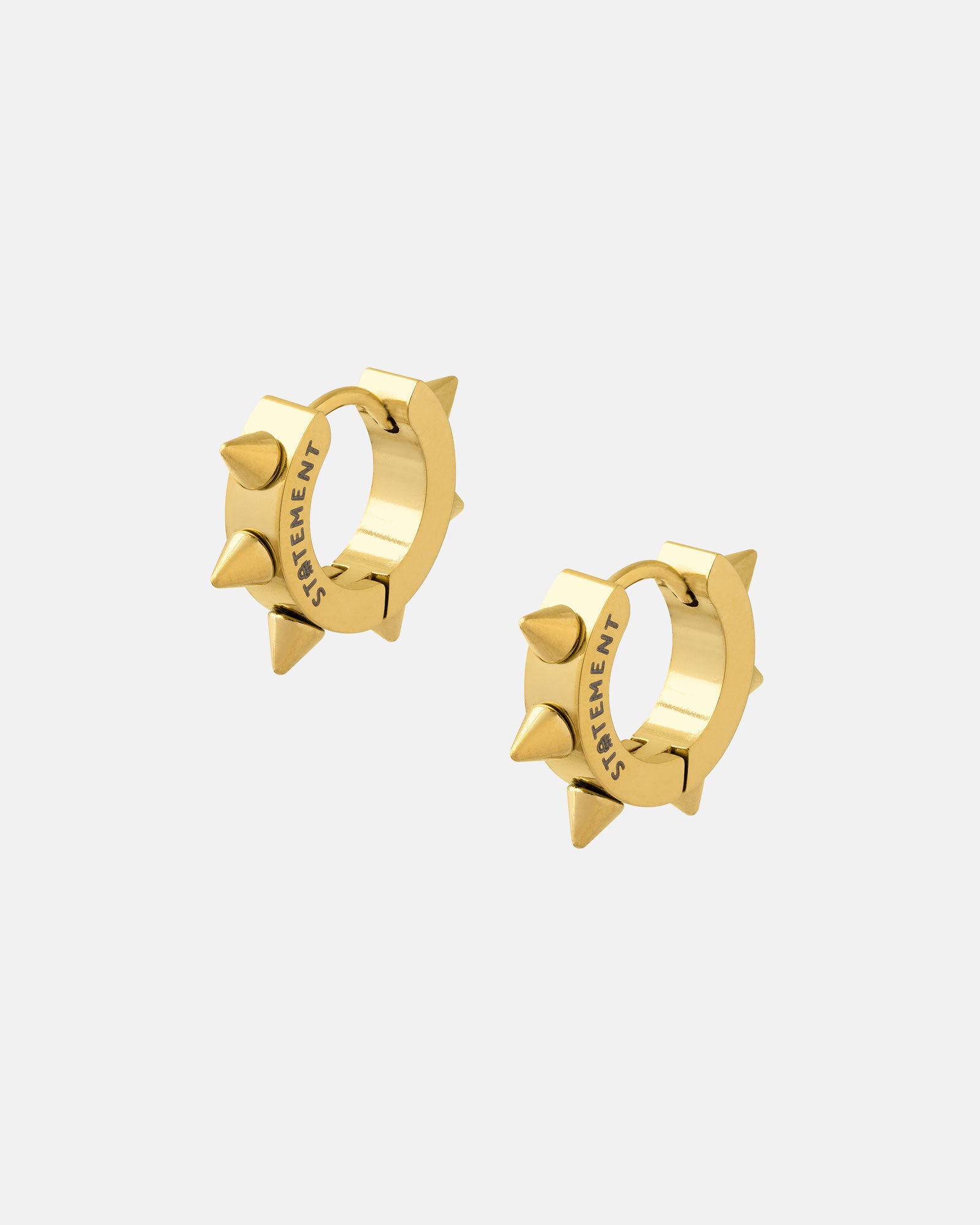 The 8mm Spiked Hoop Earrings (Gold) feature small gold hoops with evenly spaced spikes and "STATEMENT" engraved inside. Perfect for punk fashion lovers. Displayed on a plain white background.