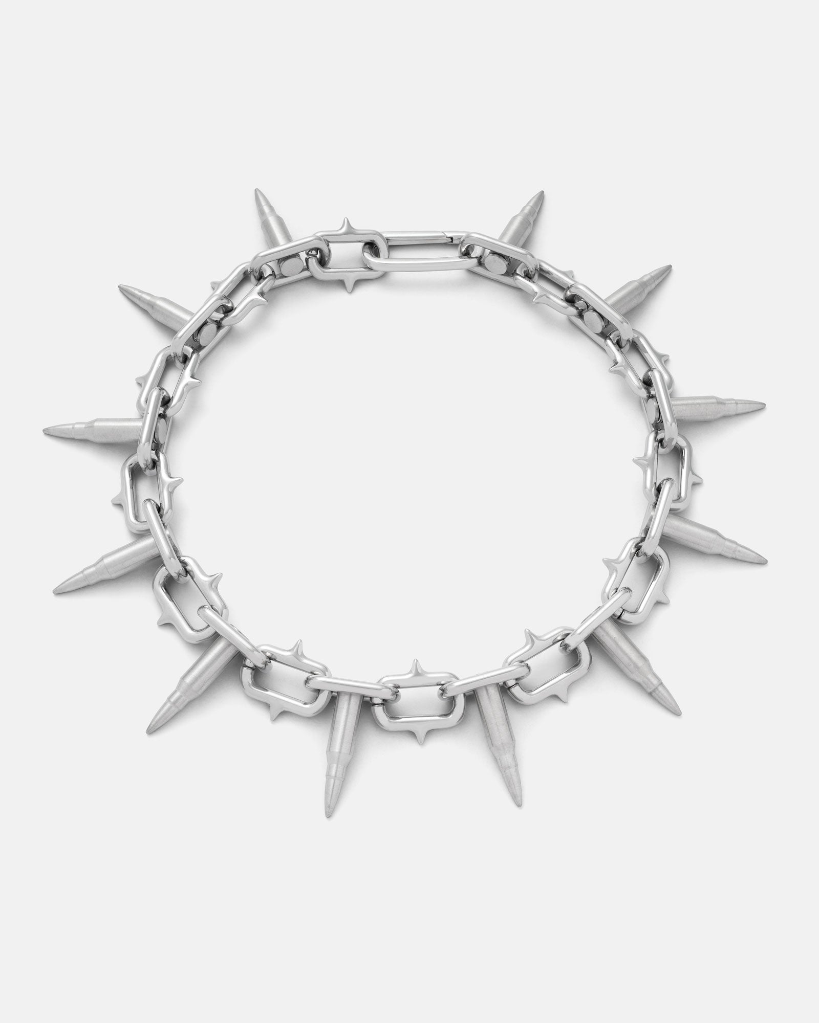 The "Sweating Bullets" Necklace Chain by Statement Collective is a bold men's jewelry piece with pointed spike pendants on a 12mm stainless steel chain, giving an edgy, heavy-duty look, shown against a plain white background.