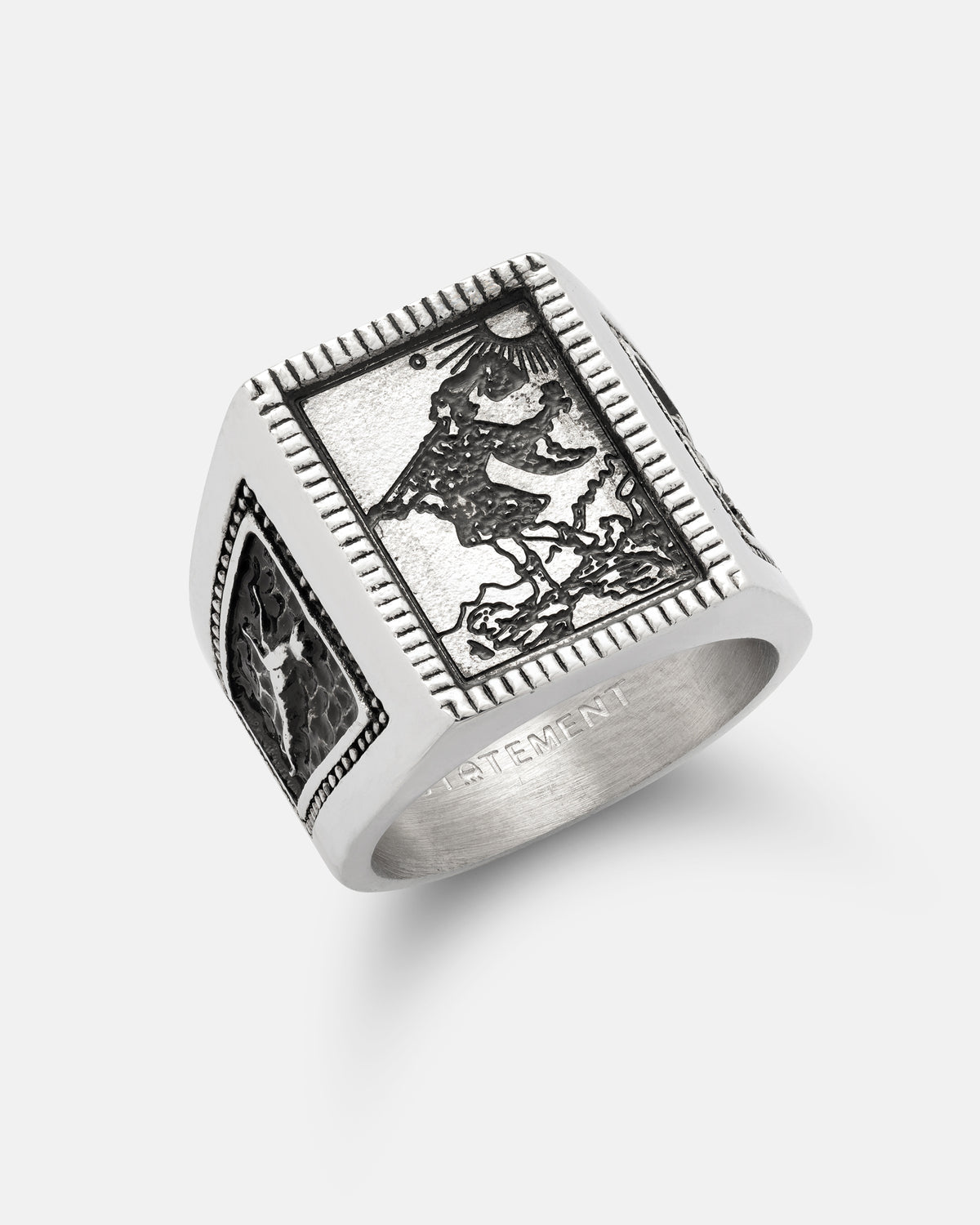 Silver Try Hard Fool signet ring featuring an engraved rectangular tarot image of a figure walking with a staff under a sun.