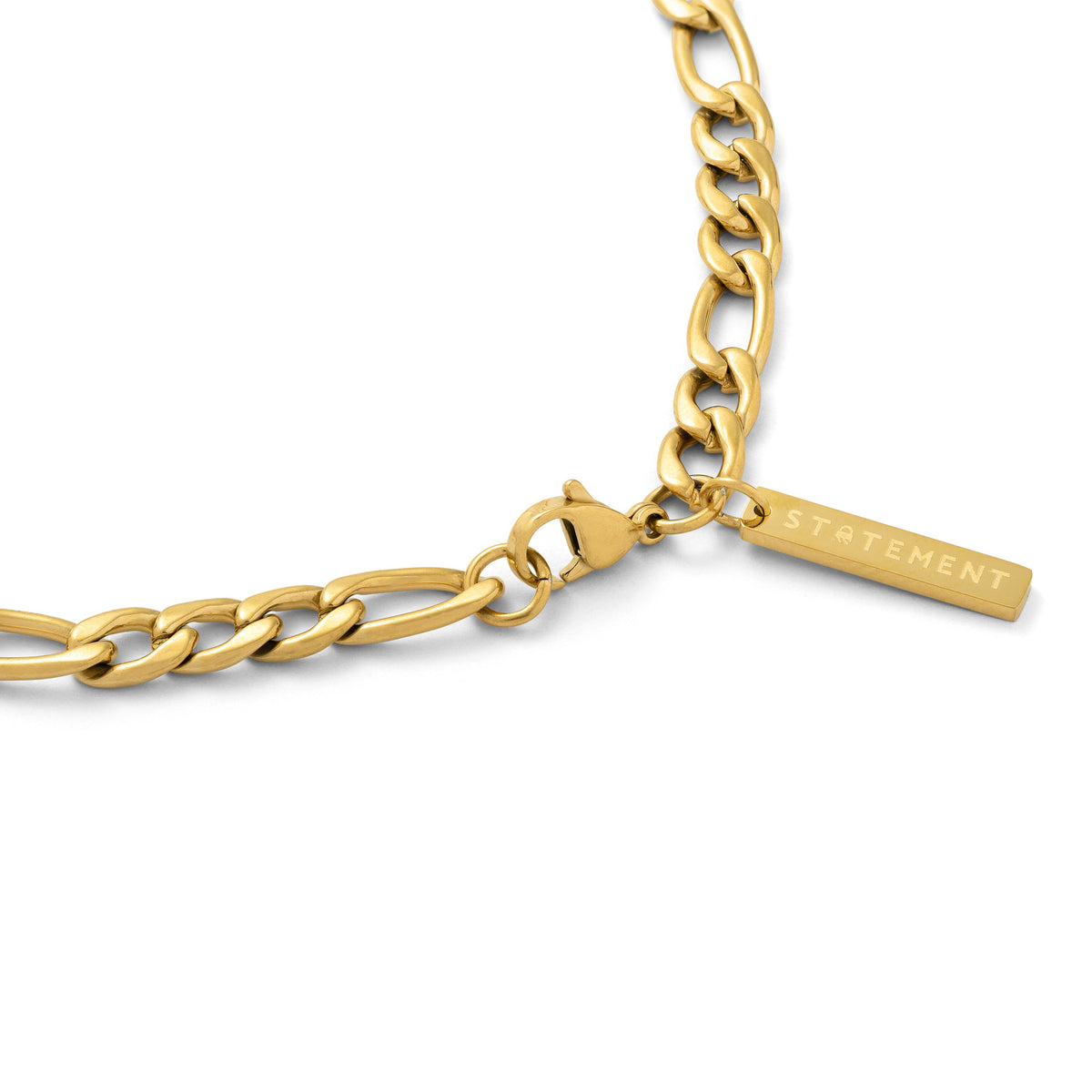 gold figaro necklace with tag by STATEMENT