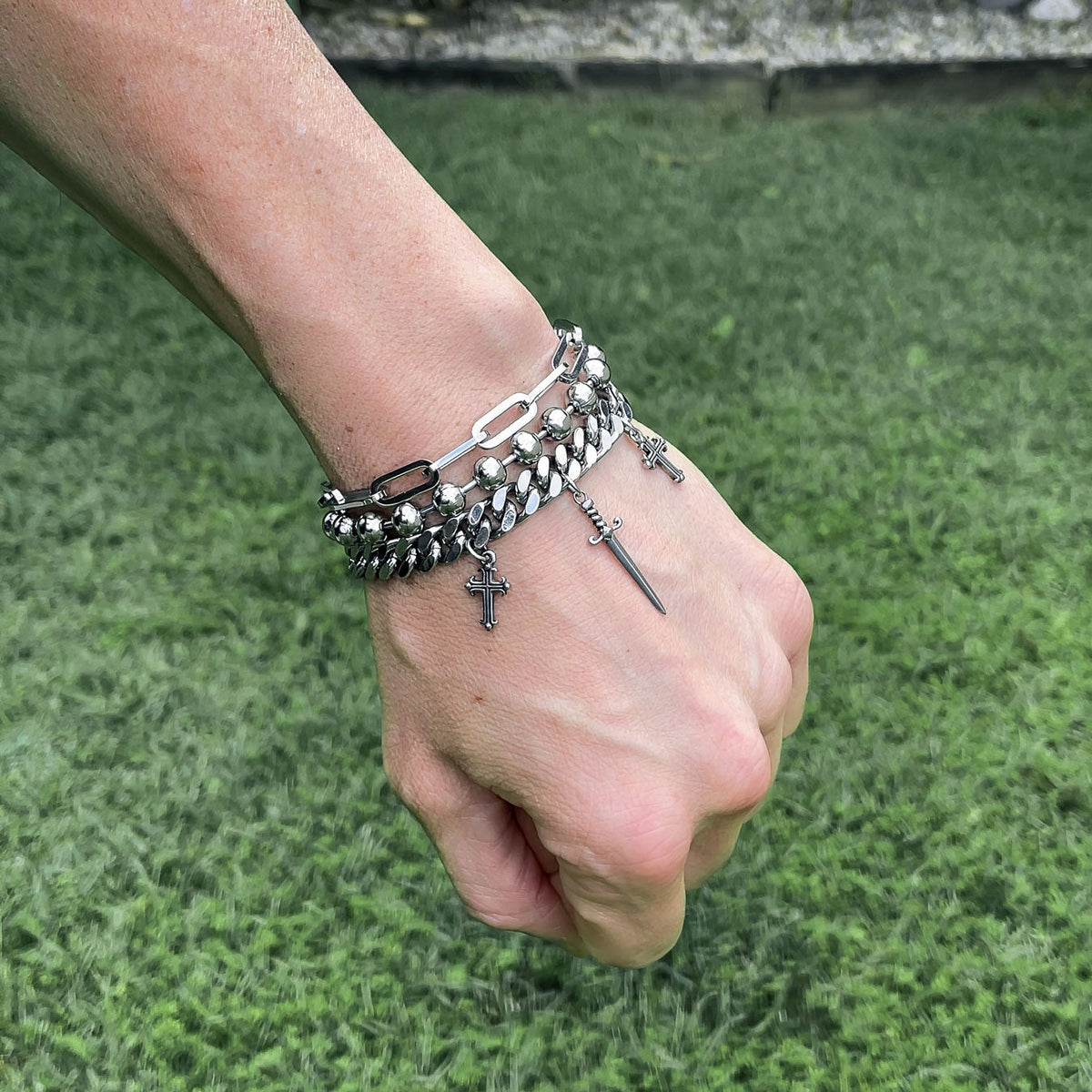 bracelet with dagger charm attached