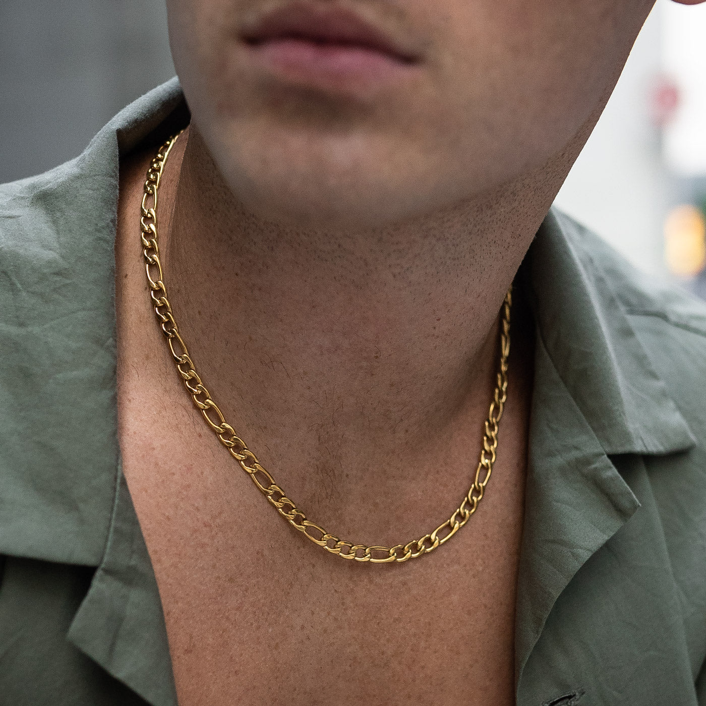 Mens thick figaro chain in gold on body