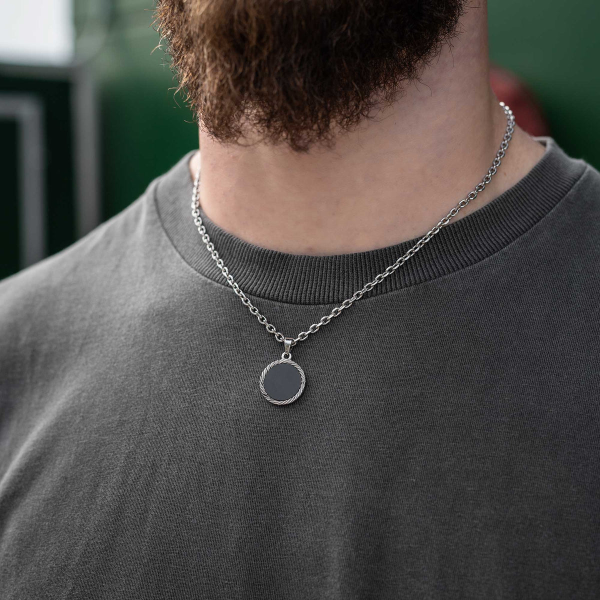 Unisex onyx stone pendant necklace on body by statement