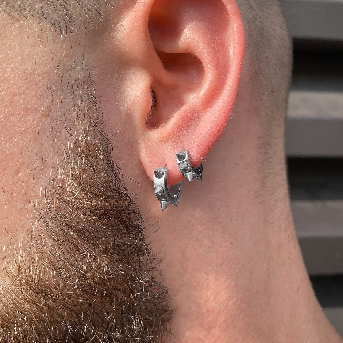 small spiked hoop earrings in silver by statement collective